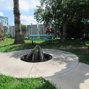 Shady picnic area with cozy fire pit!