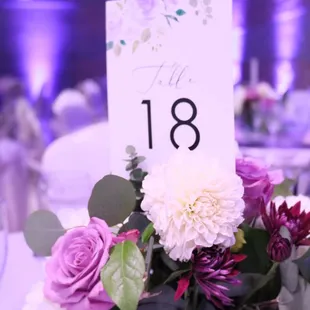 Beautiful wedding with purple uplighting by www.brightenuplighting.com decor rentals by Cornejo's Catering.