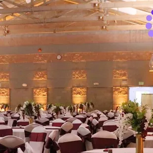 Elegant wedding at Laguna Town Hall w/ warm amber gold uplighting by www.brightenuplighting.com