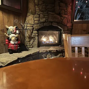 Seated by the faux fireplace