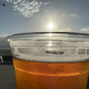 a beer in a plastic cup