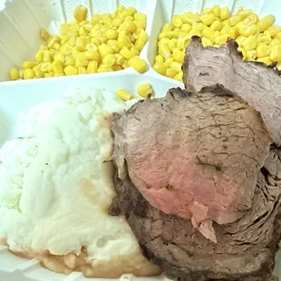 Prime Rib with mashed potatoes and corn.