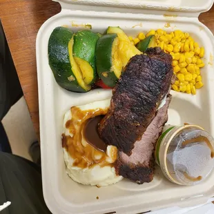 a meal in a styrofoam container
