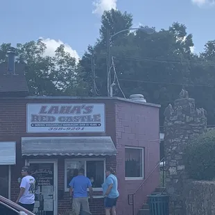 Faithful customers ordering at the window since they're indoor seating is currently closed for covid safety precautions.