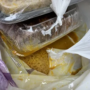 Goat Goat Feet Curry (Paya) leaking all over the plastic bag and into other food.