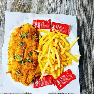 a plate of french fries and a chicken cutlet