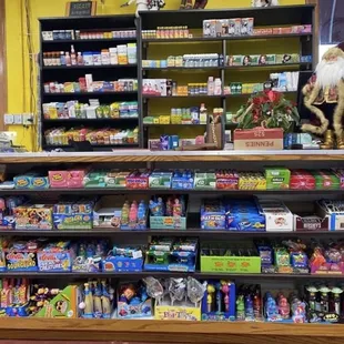 Front counter filled with kids' toys and candies. Asian knickknacks.