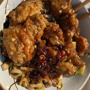 a bowl of noodles with meat and vegetables
