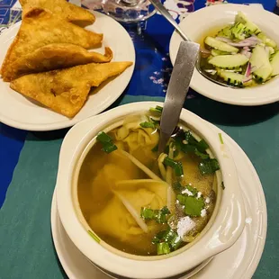 Curried chicken wonton, pork and vegetable wonton soup, sweet pickled cucumber and red onion dressing.