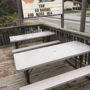 Outside seating and their sign.