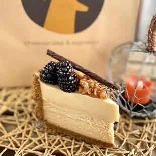 Chai Nebula $7.50 - chai cheesecake w/butterscotch mousse, caramel cornflake crunch, chocolate garnish, and fresh blackberries