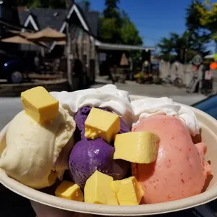 Triple scoop: passionfruit, ube (vegan), guava topped w/ cubed flan &amp; a lil whipped cream. Delicious &amp; refreshing on a hot summer day!