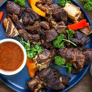 a plate of meat and vegetables