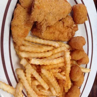 Chicken fingers with fries and corn nuggets.