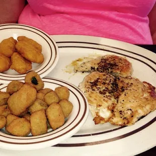 Grilled chicken with fried okra and corn nuggets.