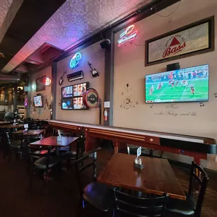 tables and chairs in a sports bar