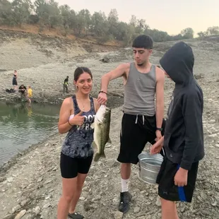 Youngest daughter Azia with her very first fish.  She pulled it in all by herself, just wouldn't hold it lol
