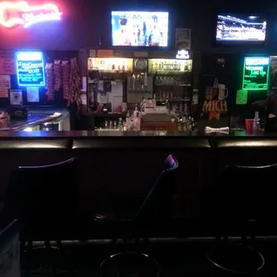 a bar with neon signs