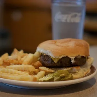 a hamburger and fries on a plate