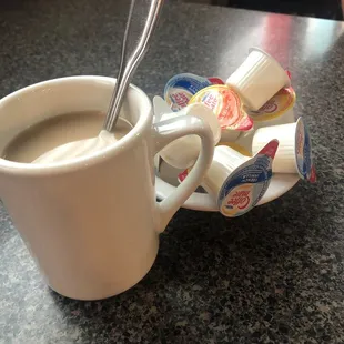 a cup of coffee and spoon