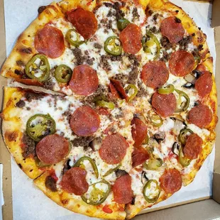 Pizza with pepperoni, jalapenos, half beef, half mushrooms