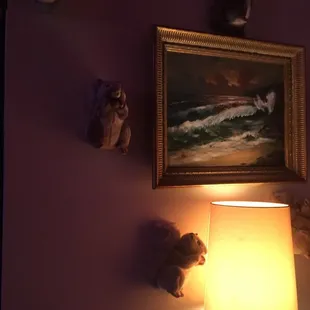 a picture of a lamp and a painting on the wall