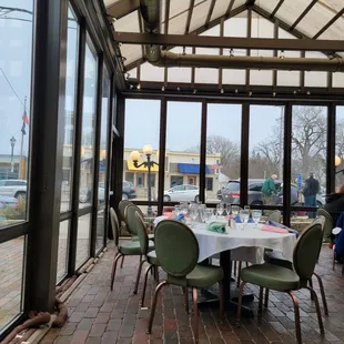 a patio with a table and chairs
