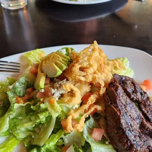 Steak salad plated for two.