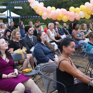 a large crowd of people sitting in chairs