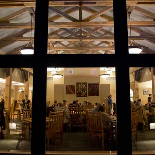 a dining room with a view of the lake