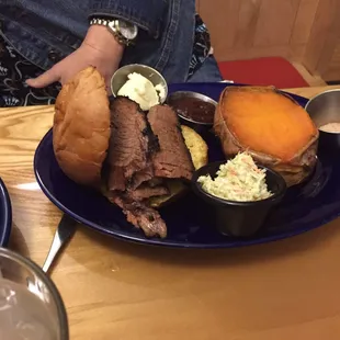 Beef Brisket sandwich with a baked sweet potato.
