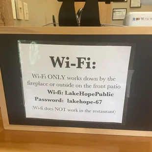 WiFi sign at the front host station - but not available IN the restaurant.  LOL