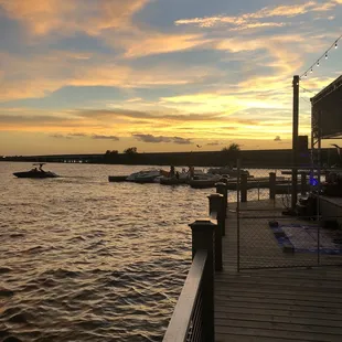 a dock with boats on the water