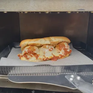 Meatball sub being toasted