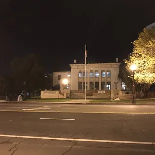 Veterans Memorial Building at night.  Entrances is on the left hand side facing the building from the front.   Look for the awning.