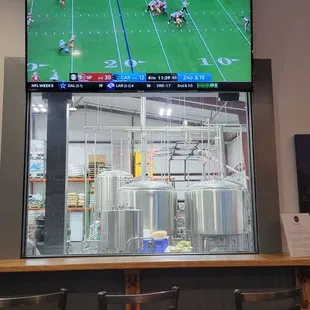 a large television screen with a football game on it