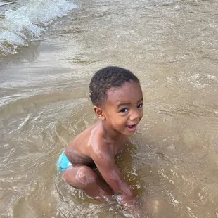 My son in the water having fun