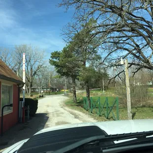 Dodging an overhead overgrown tree and a hedge that has not been trimmed at entrance( no one greets you.....) very difficult to get into.
