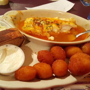 Broiled haddock with potato puffs.