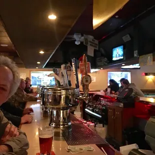 a woman sitting at a bar