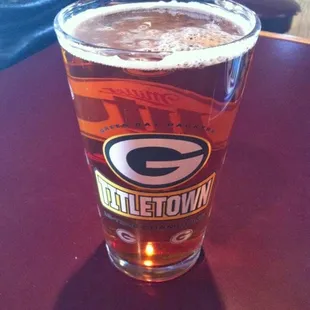 a glass of beer on a table