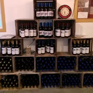 a large stack of wine bottles