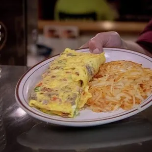 a plate of omelets and hash browns