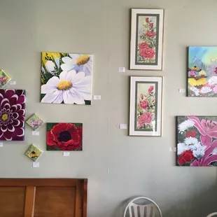 a variety of paintings on the wall