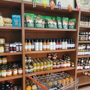 a grocery cart in front of the shelves