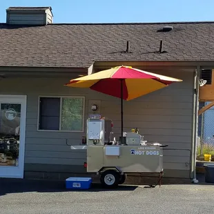 Hot dog stand outside.