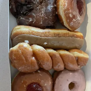 Maple Bar, regular glazed, raspberry filled, cinnamon twist, bear claw, and strawberry dipped