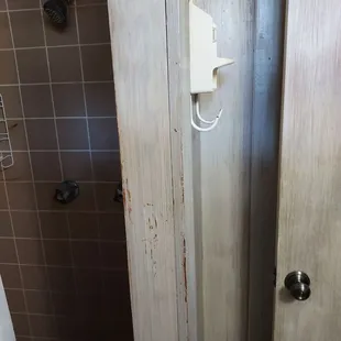a bathroom with a toilet and shower