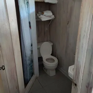 a toilet in a small bathroom