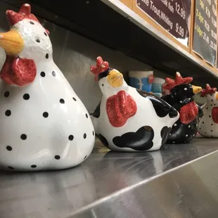 a row of ceramic chickens